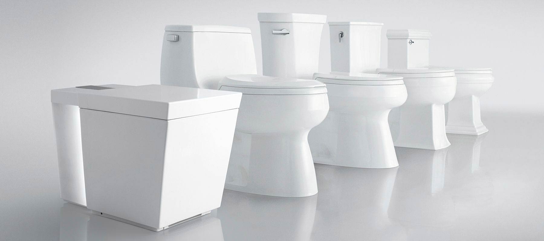 A Row Of Toilets With A Visible Toilet Seat